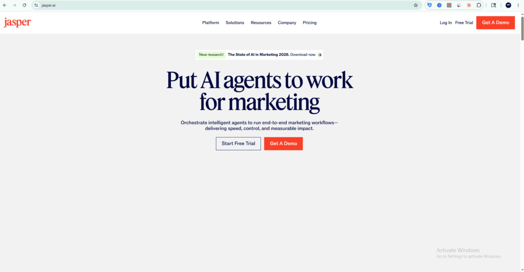 Jasper AI official website homepage showing Put AI agents to work for marketing tagline with Start Free Trial and Get A Demo buttons